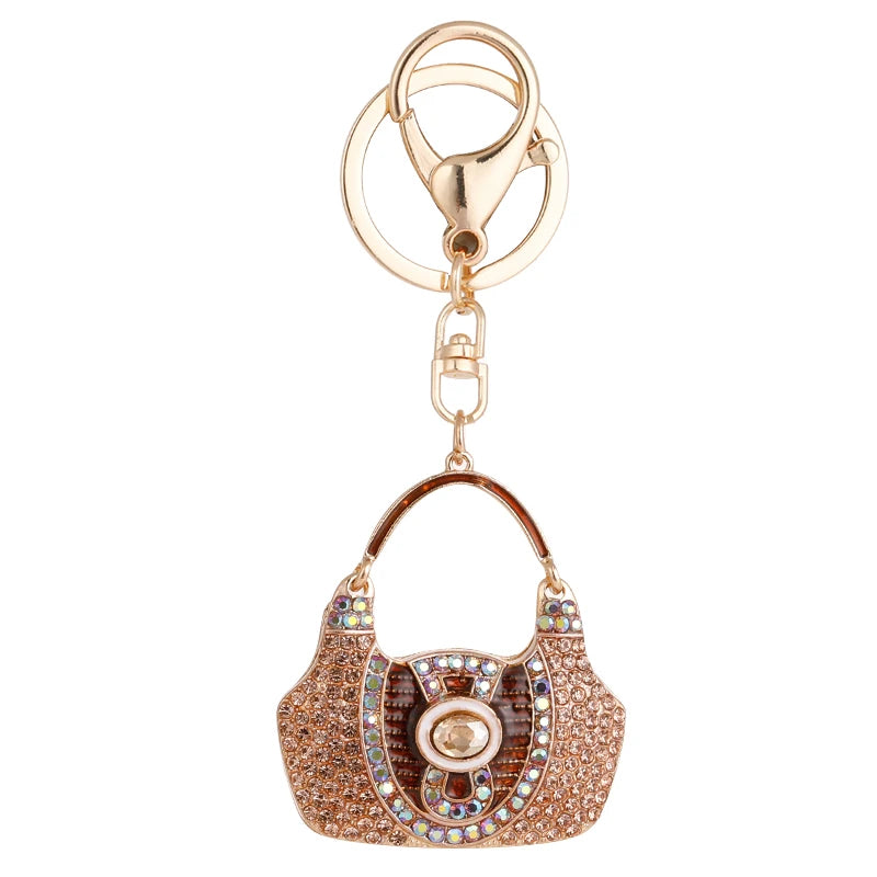 Luxe Purse Keychain with a sparkling rhinestone design, crafted from durable zinc alloy. Compact and lightweight at 1.44 oz, measuring 4.72 inches by 1.97 inches, perfect for adding a touch of elegance to your keys or bag.