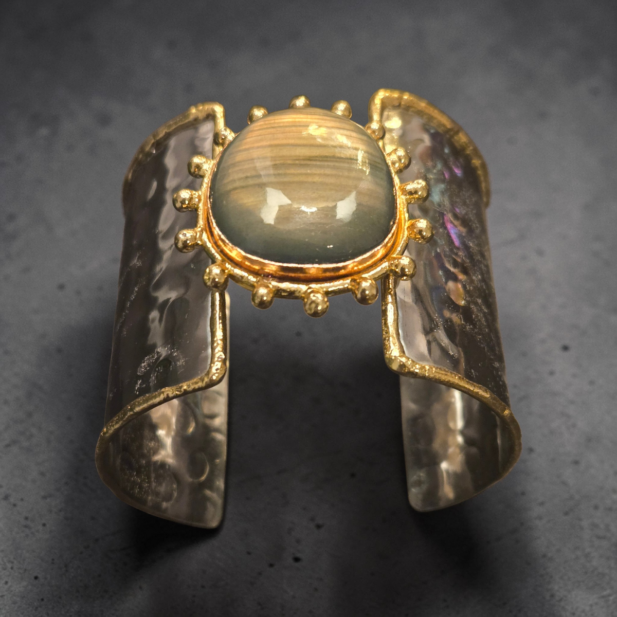 Arden Sage Cuff bracelet featuring a sage-gray labradorite stone set in brass and stainless steel with marbled enamel panels and gold detailing. ZoharasVogue