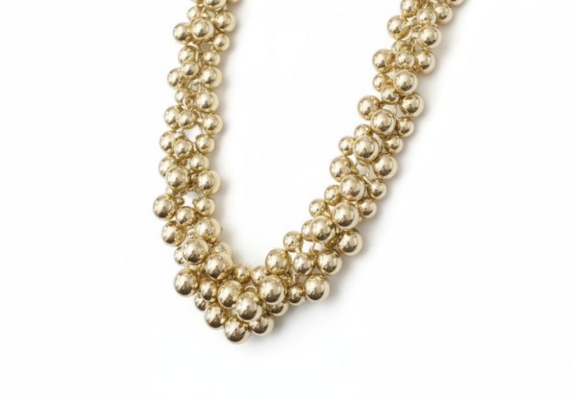 Polished plated beaded statement necklace with layered design, bold and modern jewelry.