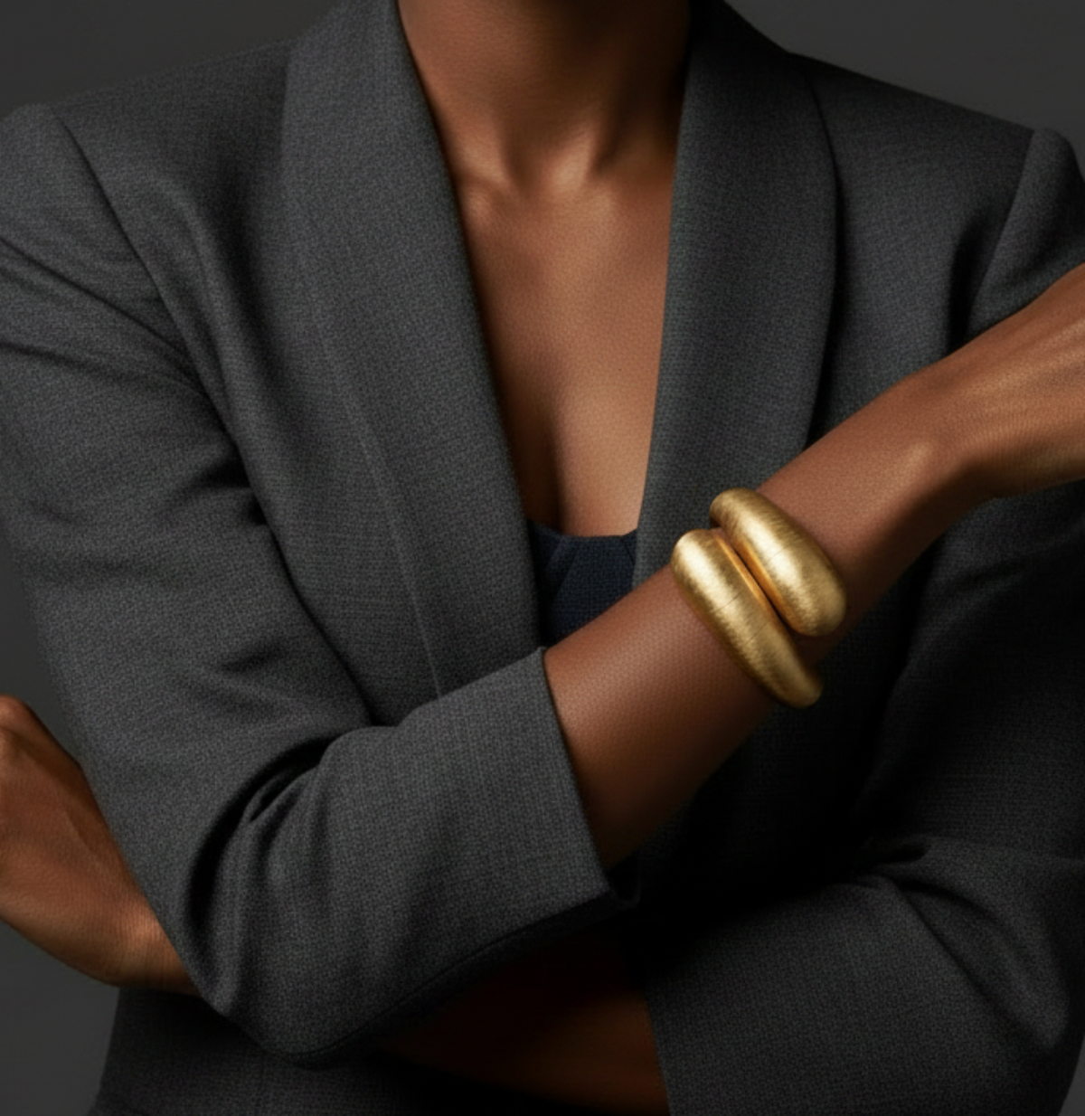 Model wearing a gray blazer Showcasing Aurora_Statement_Bracelet__ZoharasVogue