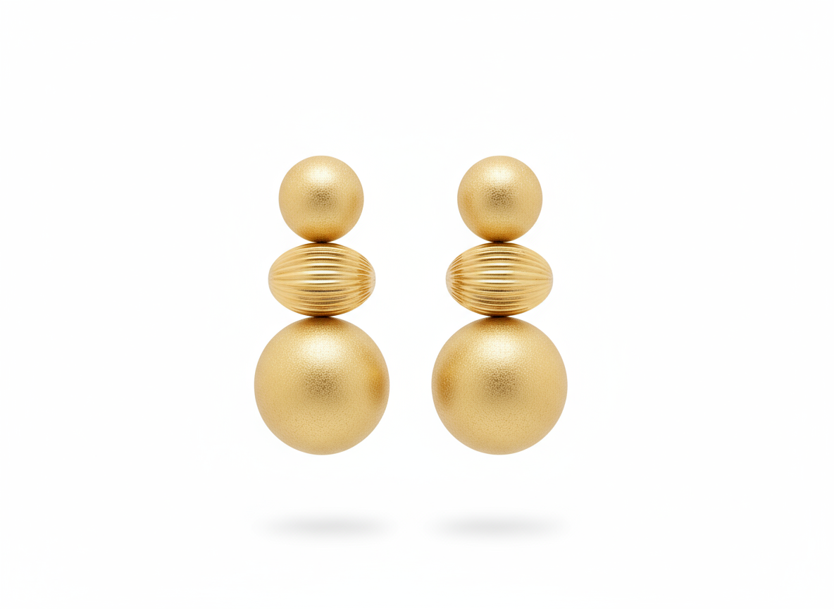 A pair of Calia Matte Balance Earrings — geometric tiered matte gold earrings with a striped texture and sculptural form, styled for modern elegance.