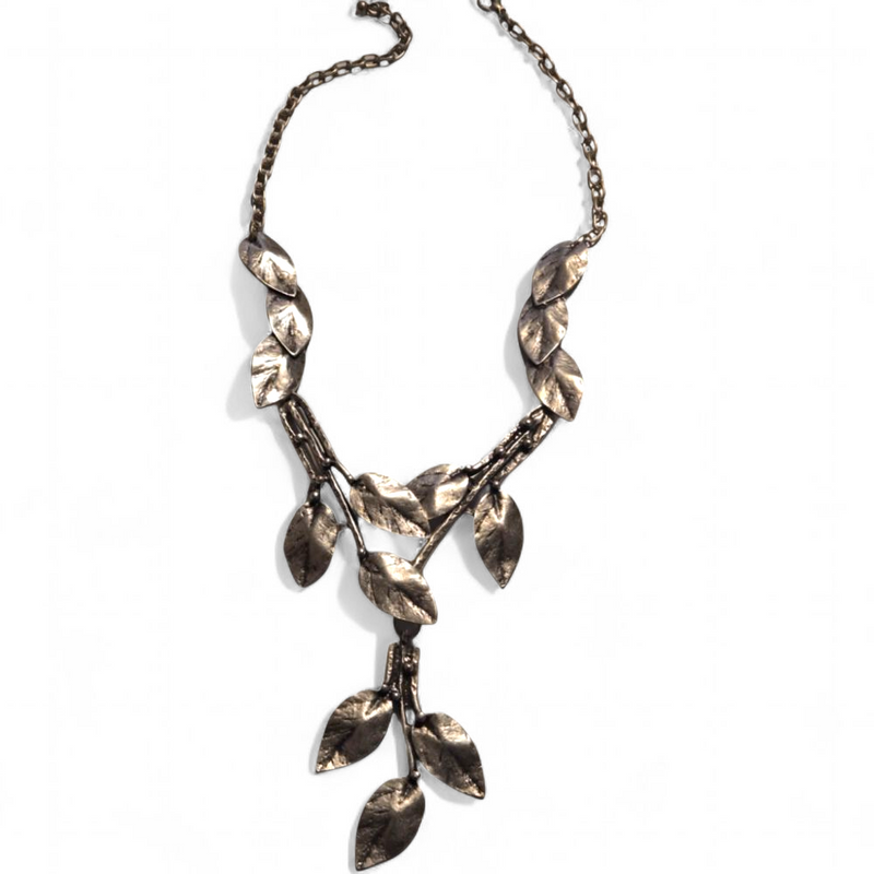 Antique Silver leaf-shaped necklace on a white background

