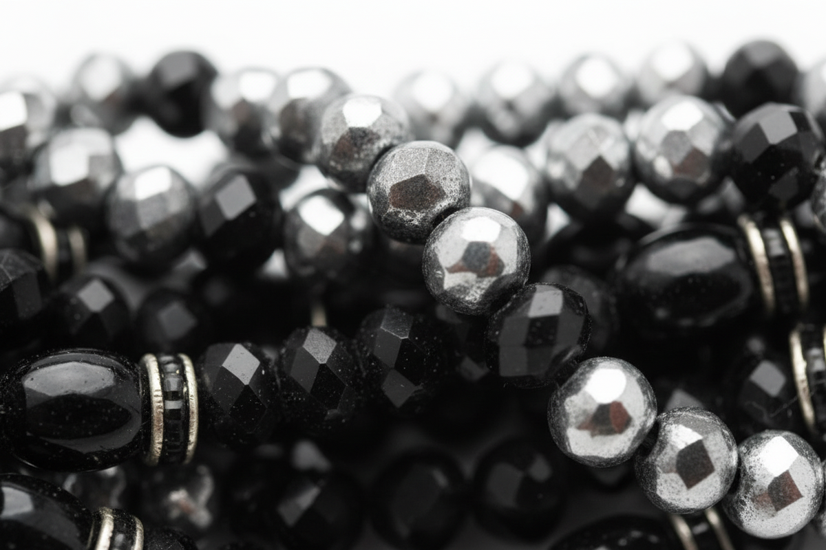 Elara Midnight Swan Necklace featuring layered faceted black and silver glass beads with rhinestone details and oversized pavé clasp.