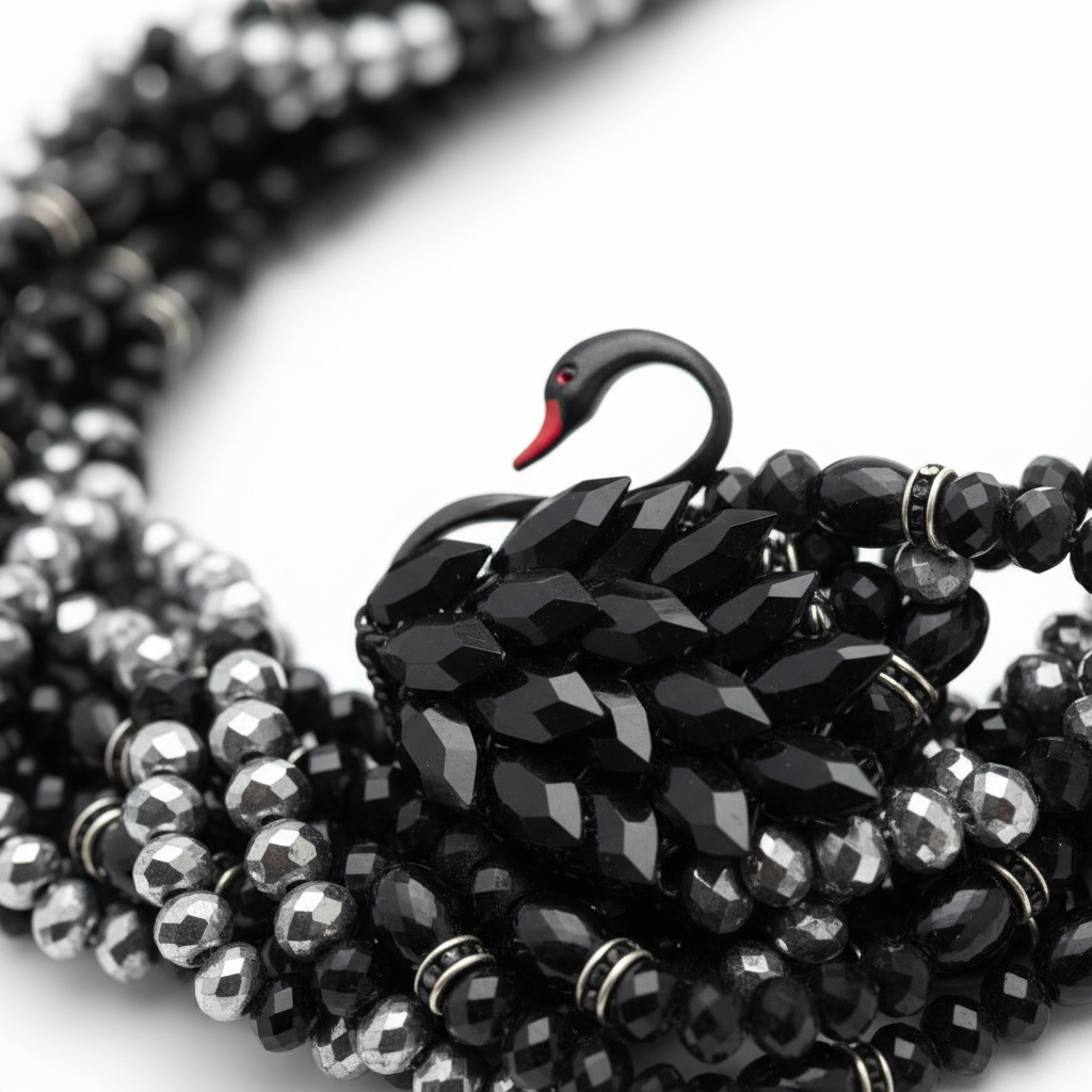 Elara Midnight Swan Necklace featuring layered faceted black and silver glass beads with rhinestone details and oversized pavé clasp.