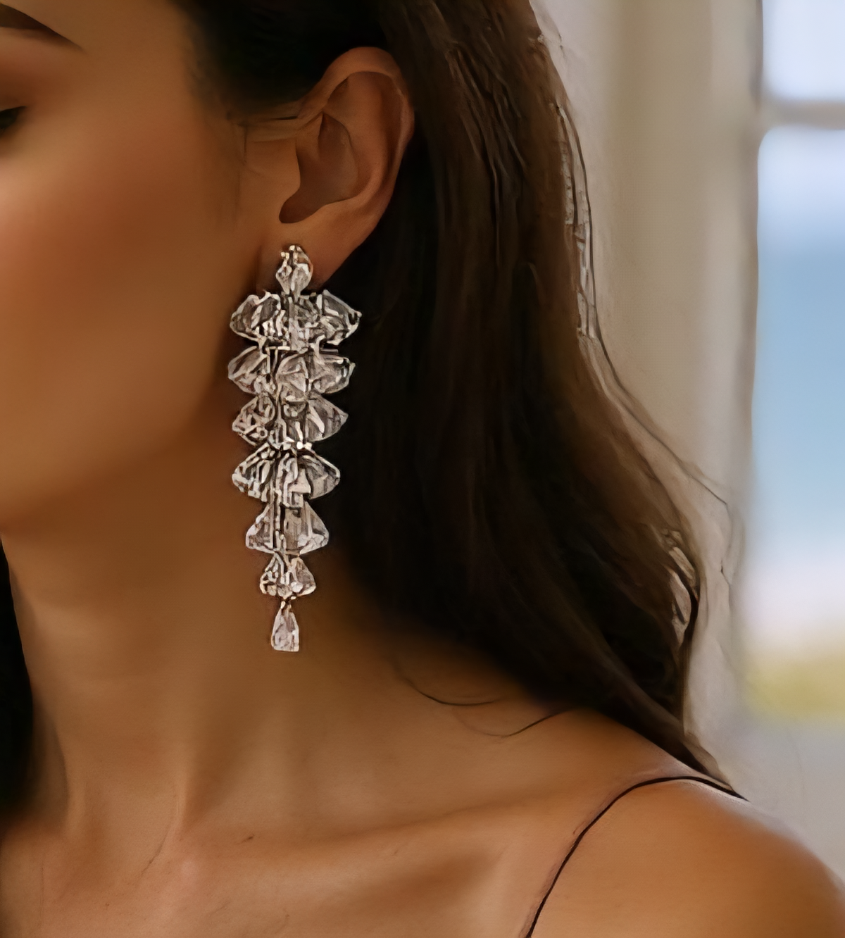 Tiered crystal drop earrings featuring sparkling clear stones in a cascading design, set in silver-tone zinc alloy with a silver post; elegant and bold fashion accessory for women. ZoharasVogue