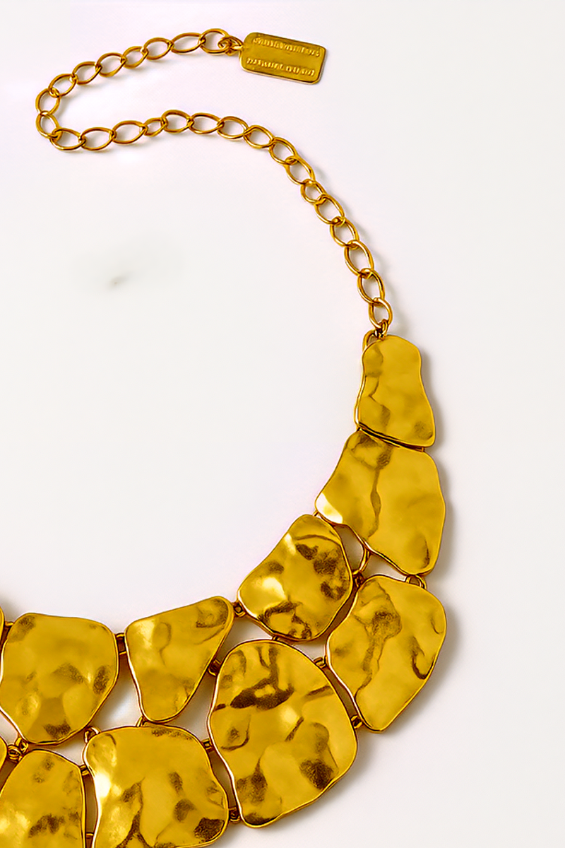 Crafted from 24-karat gold–plated pewter, this striking statement piece evokes the look of hammered metal polished to a luminous gleam. ZoharasVogue 