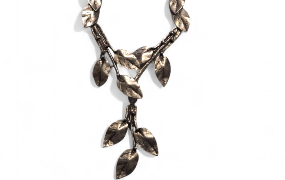 Antique Silver leaf-shaped necklace on a white background