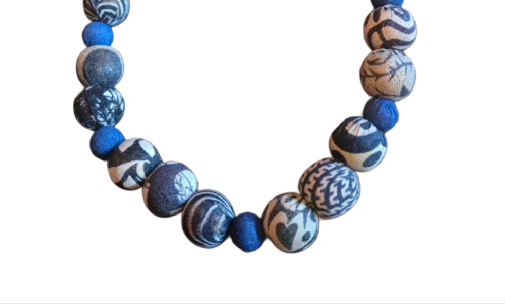 Handmade indigo and black-and-white Kantha beaded necklace with alternating bead sizes and collar-style fit.