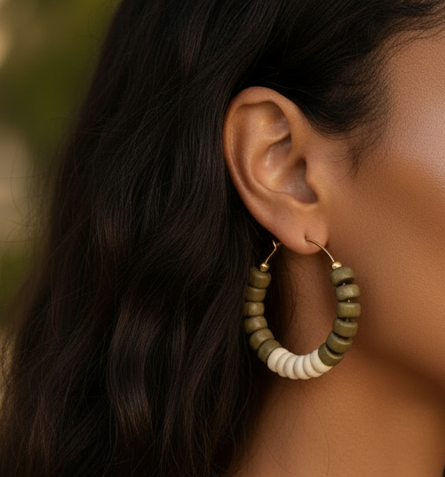 18k gold hoop earrings, cowrie shell hoops, hematite bead earrings, sage green jewelry, medium hoop earrings, statement hoops, Caribbean jewelry, boho gold earrings, coastal earrings, artisan hoop earrings, natural shell jewelry, modern bohemian hoops, gold plated earrings. ZoharasVogue