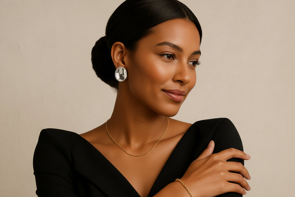 Model wearing a black top with a beige background