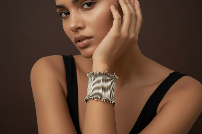 Model wearing a silver bracelet on a beige background_ZoharasVogue 