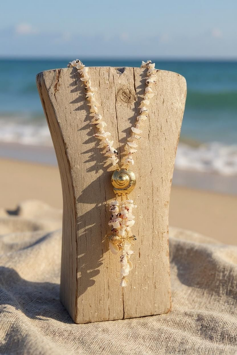 Marina Pearl Necklace Handmade long statement necklace with pearl fringe, mixed seashell charms, gold snail pendant, and mocha leather cord. ZoharasVogue 