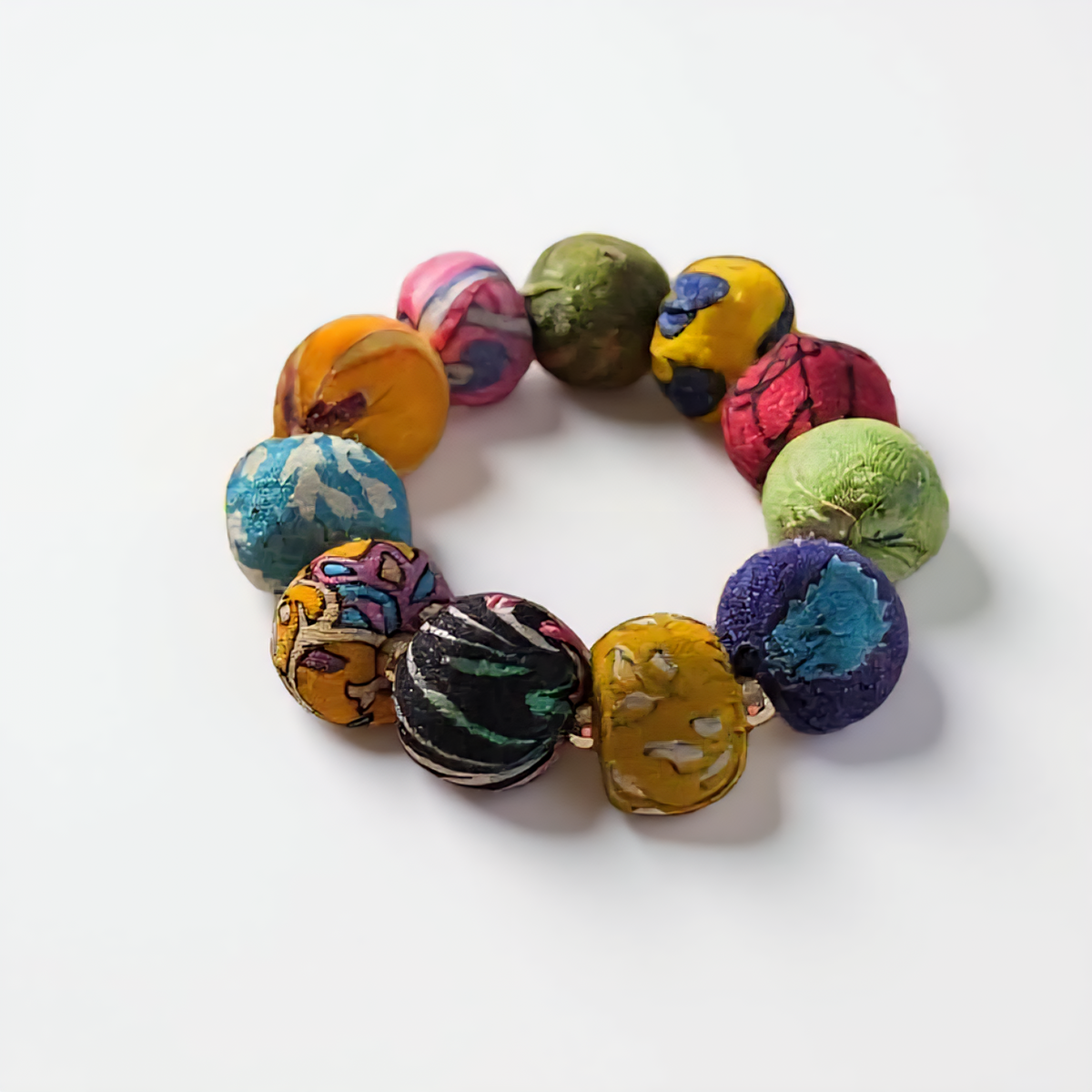 Colorful fabric beaded bracelet with gold accents, handcrafted from repurposed Kantha textiles. ZoharasVogue