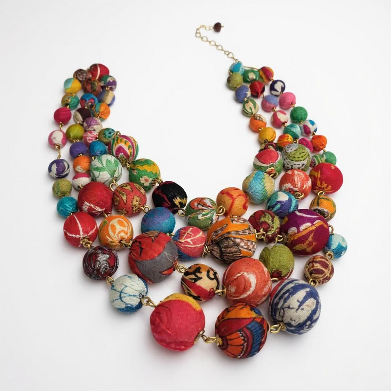 Multi-strand Kantha bead necklace with bold cascading design, handcrafted from repurposed sari textiles in vibrant colors. ZoharasVogue