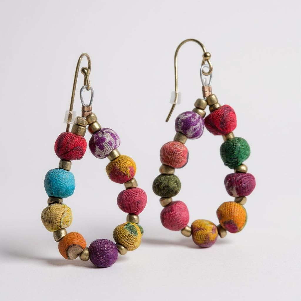 Teardrop earrings with graduated round Kantha beads in colorful patterns, handcrafted from repurposed textiles.
