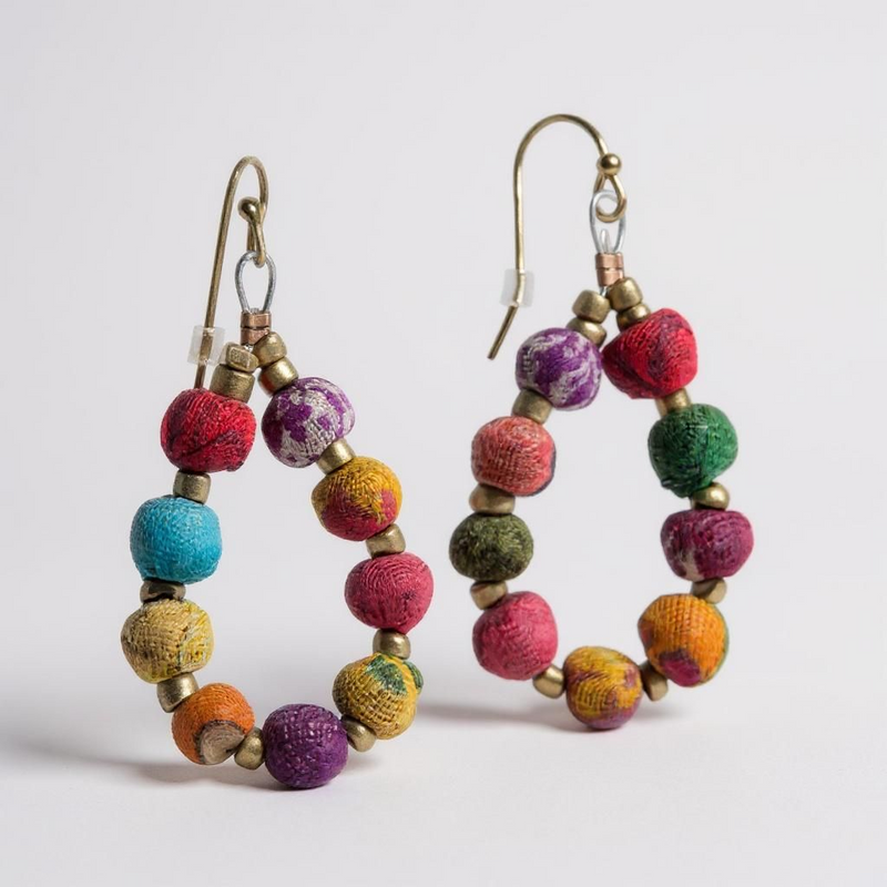 Teardrop earrings with graduated round Kantha beads in colorful patterns, handcrafted from repurposed textiles.
