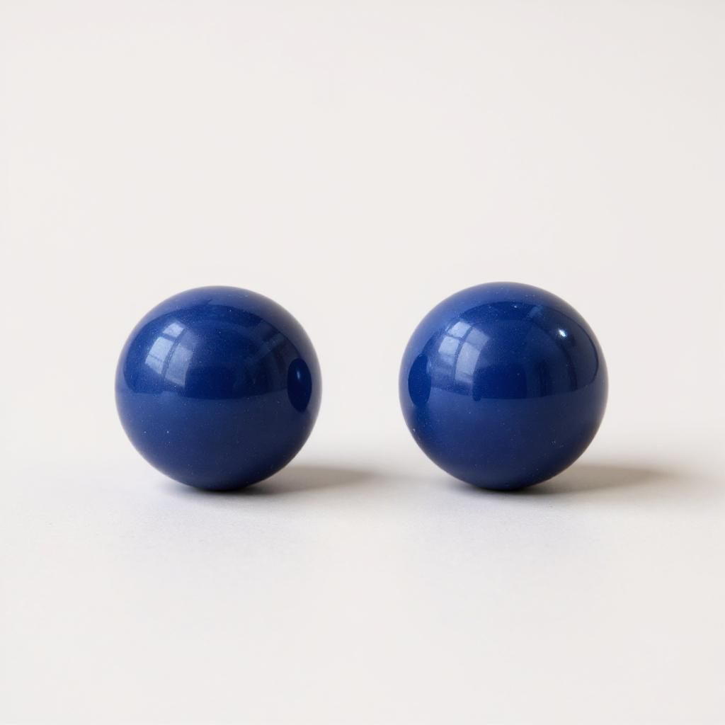 Medium navy blue acrylic geometric stud earrings with minimalist design.

