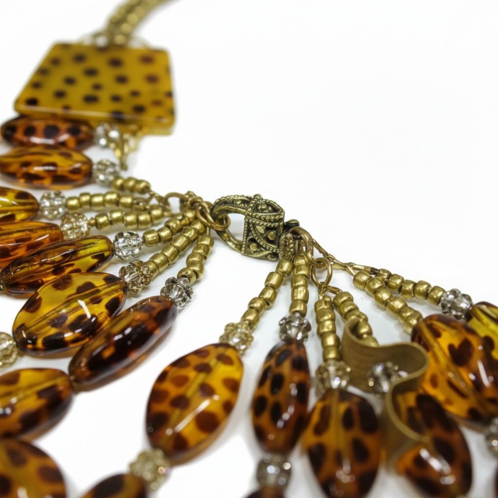 Necklace with tortoiseshell beads and gold accents on a white background_ZoharasVogue 