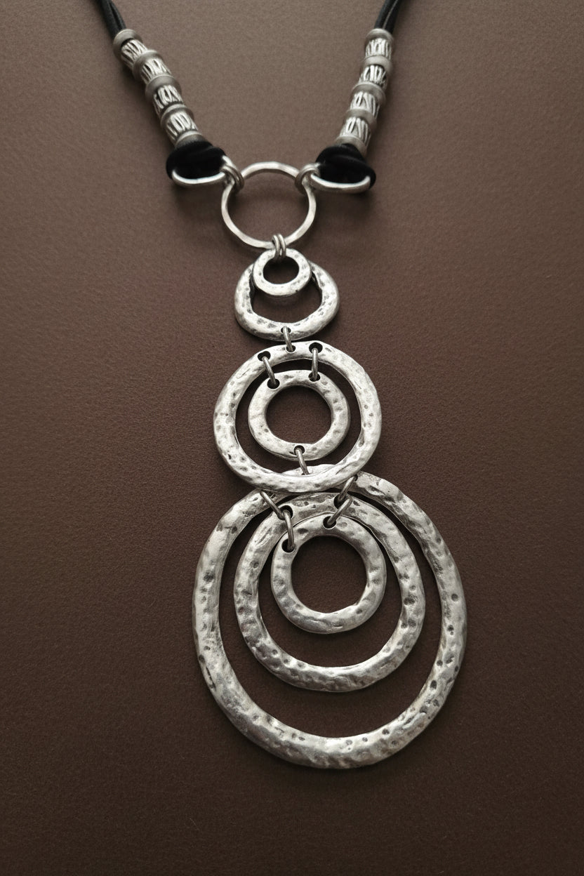 Silver Boho Echo Necklace against a gray background ZOHARAS VOGUE