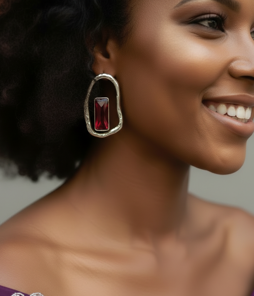 Silver plated boho-style earrings with a bold red stone centerpiece and organic sculpted design._ZoharasVogue