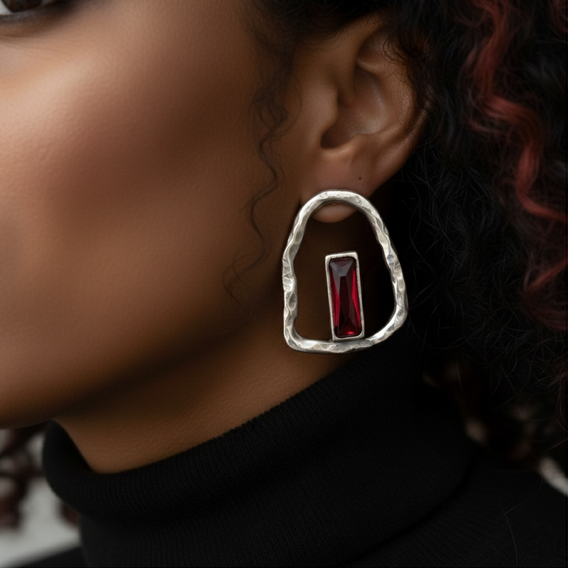 Silver plated boho-style earrings with a bold red stone centerpiece and organic sculpted design._ZoharasVogue