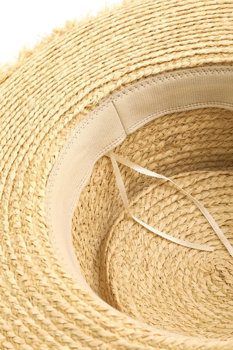 Straw sun hat with a basket weave pattern and wide brim. ZoharasVogue Collection