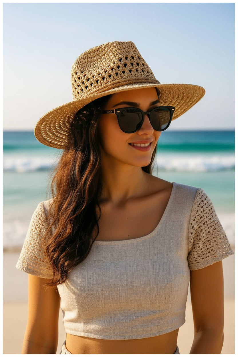A studio display of the ZoharasVogue Soleil Weave Sun Hat, showcasing its luxurious basket-weave straw pattern, wide 4-inch brim, and elegant structured silhouette.