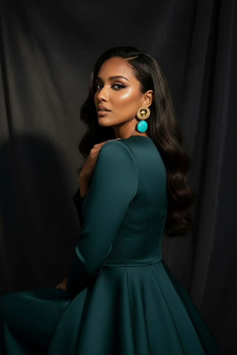 Solstice Eclipse Stone Earrings model in a teal dress with large earrings against a dark background_ZoharasVogue