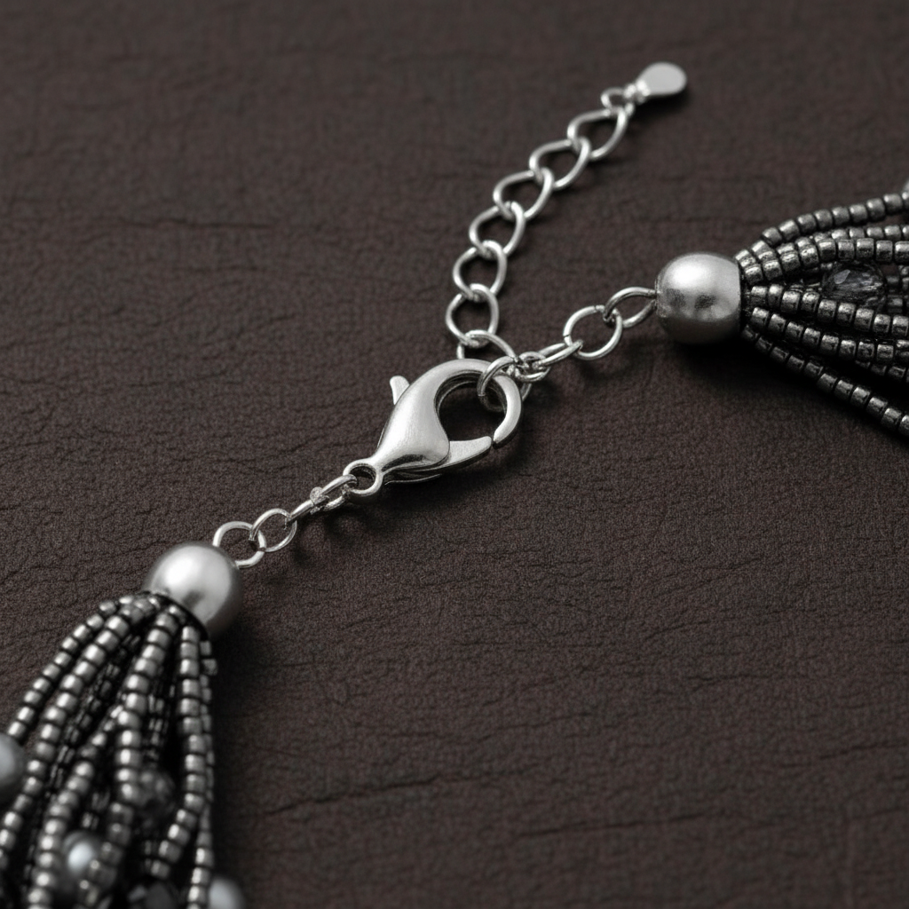 Close-up of a beaded tassel Closeup necklace on a dark surface Soraya Bloom Collar™ Necklace_Zoharas Vogue