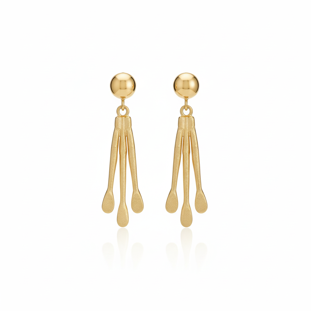 Pair of gold earrings on a white background_ZoharasVogue