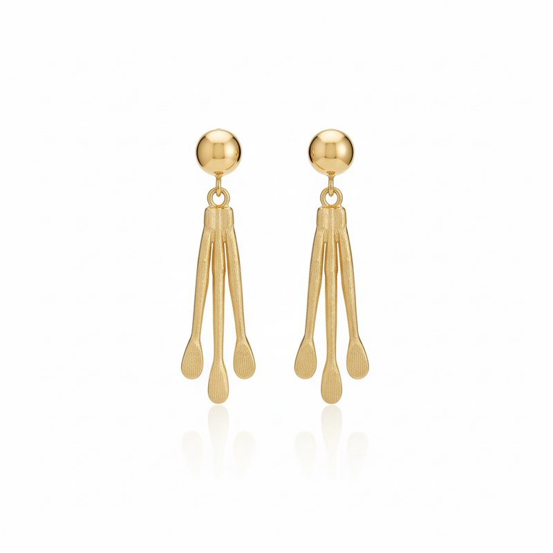 Pair of gold earrings on a white background_ZoharasVogue