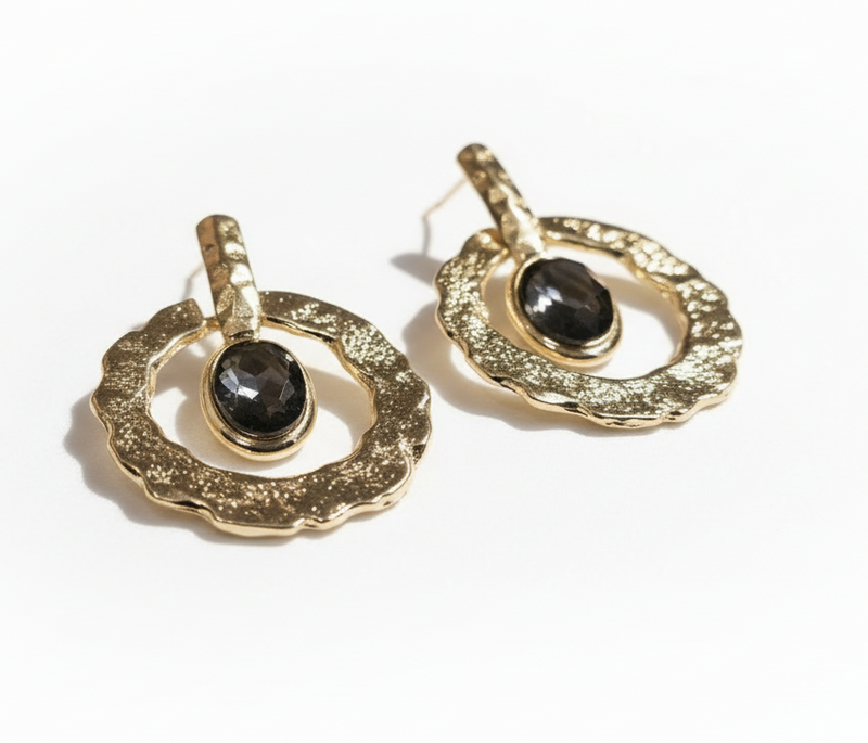 Gold earrings with black gemstones on a white background_ZoharasVogue