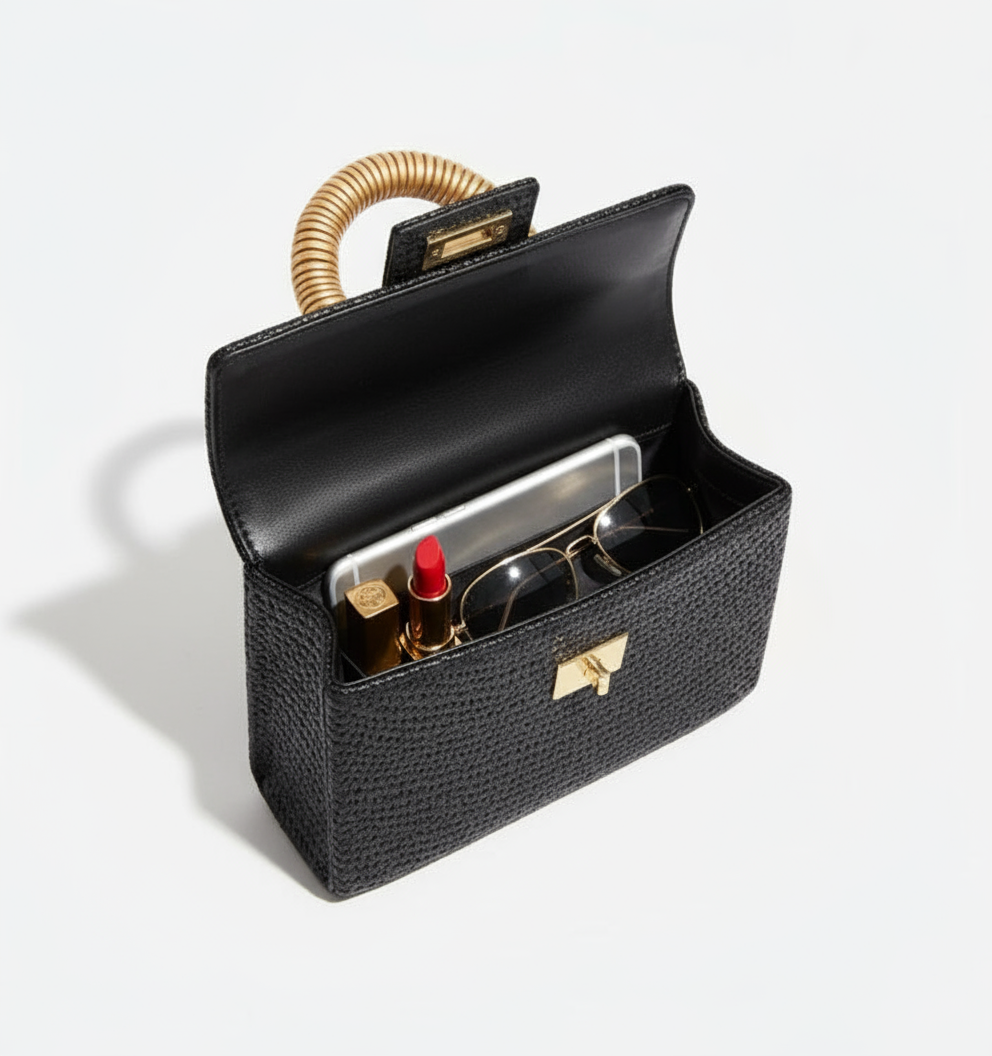 Soli & Sun Noir Solstice black buntal clutch with shell inlay handle and gold bead accents. ZoharasVogue