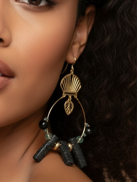 Handcrafted gold-tone statement earrings featuring a fan-shaped top, open hoop design, black textured bar beads, navy and aqua accent beads, gold spacers, and a small leaf charm. ZoharasVogue 