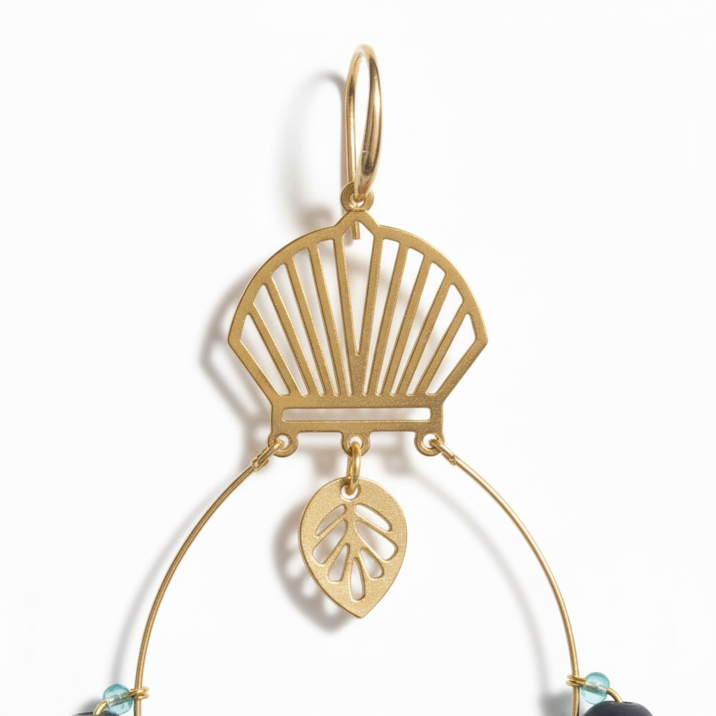 Handcrafted gold-tone statement earrings featuring a fan-shaped top, open hoop design, black textured bar beads, navy and aqua accent beads, gold spacers, and a small leaf charm. ZoharasVogue 