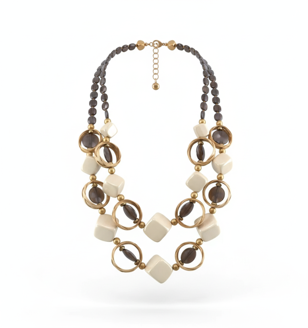 Double-layer statement necklace made of Gmelina arborea wood, glossy resin, seabeads, and textured raffia with bold geometric shapes.ZoharasVogue