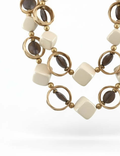 Double-layer statement necklace made of Gmelina arborea wood, glossy resin, seabeads, and textured raffia with bold geometric shapes.ZoharasVogue