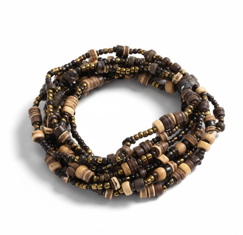 Unwoven Bracelet featuring layered organic beads and natural textures with an easy stretch fit, offering tropical-inspired elegance. ZoharasVogue