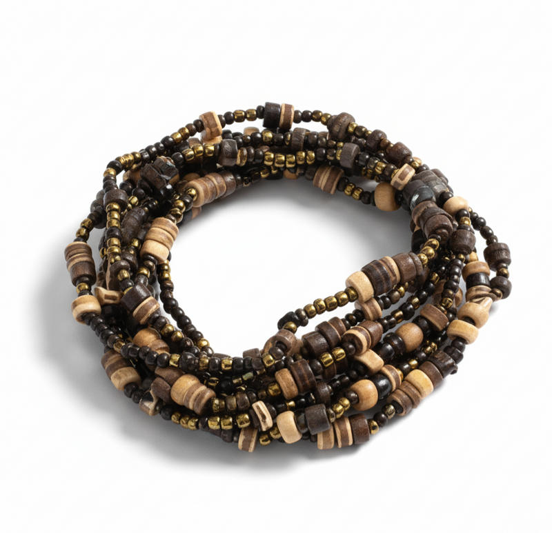 Unwoven Bracelet featuring layered organic beads and natural textures with an easy stretch fit, offering tropical-inspired elegance. ZoharasVogue