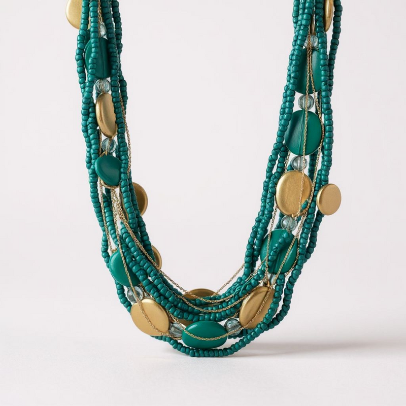 Handcrafted necklace made of coconut shell and Gmelina wood beads with turquoise and gold accents.