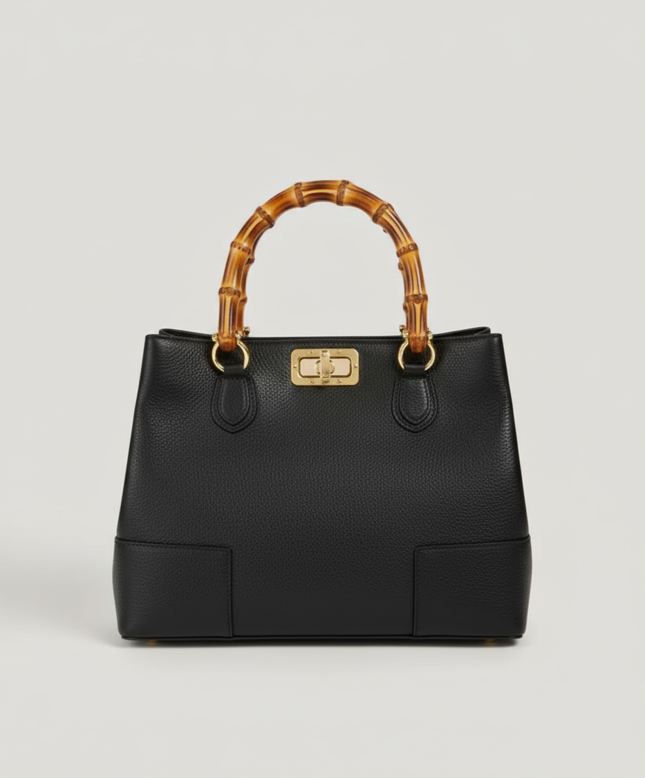 Valencia Rue Bag – handcrafted Italian calfskin leather handbag with bamboo handles, light gold hardware, and bamboo clasp closure, featuring dual compartments and an adjustable shoulder strap for refined everyday elegance. ZoharasVogue