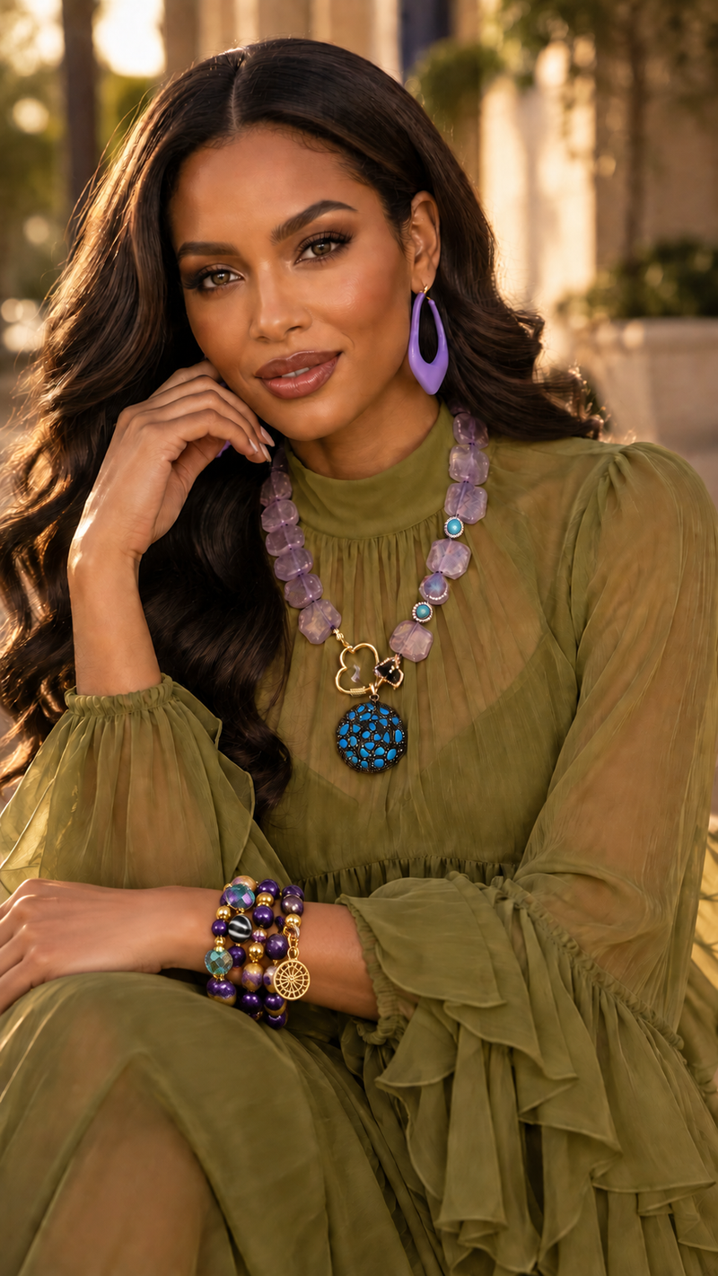 Zafira Radiant layered bracelet by ZoharasVogue featuring purple Sugilite Agate, purple-yellow Fire Agate, iridescent crystal beads, gold accents, and a sunburst charm.