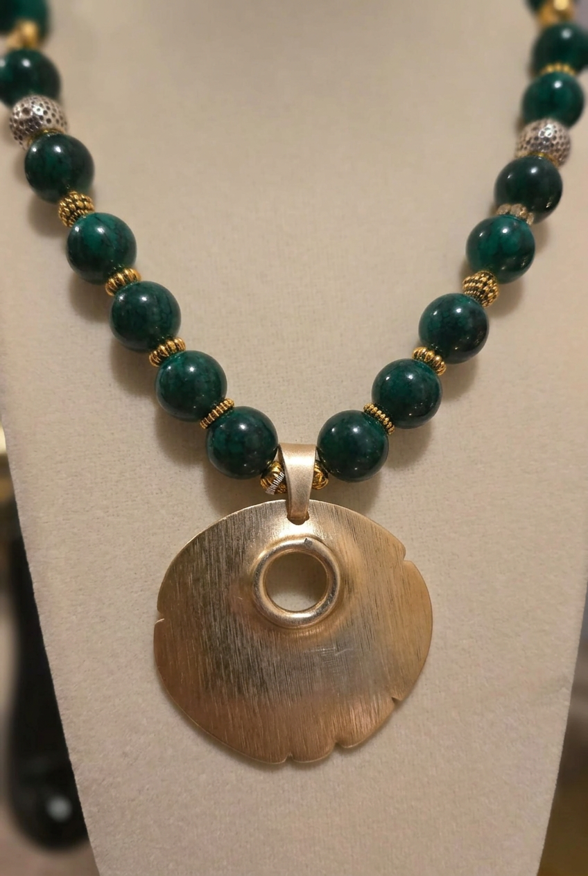 Zafira Verdant Medallion Necklace with forest-green beads and sculptural gold-tone pendant