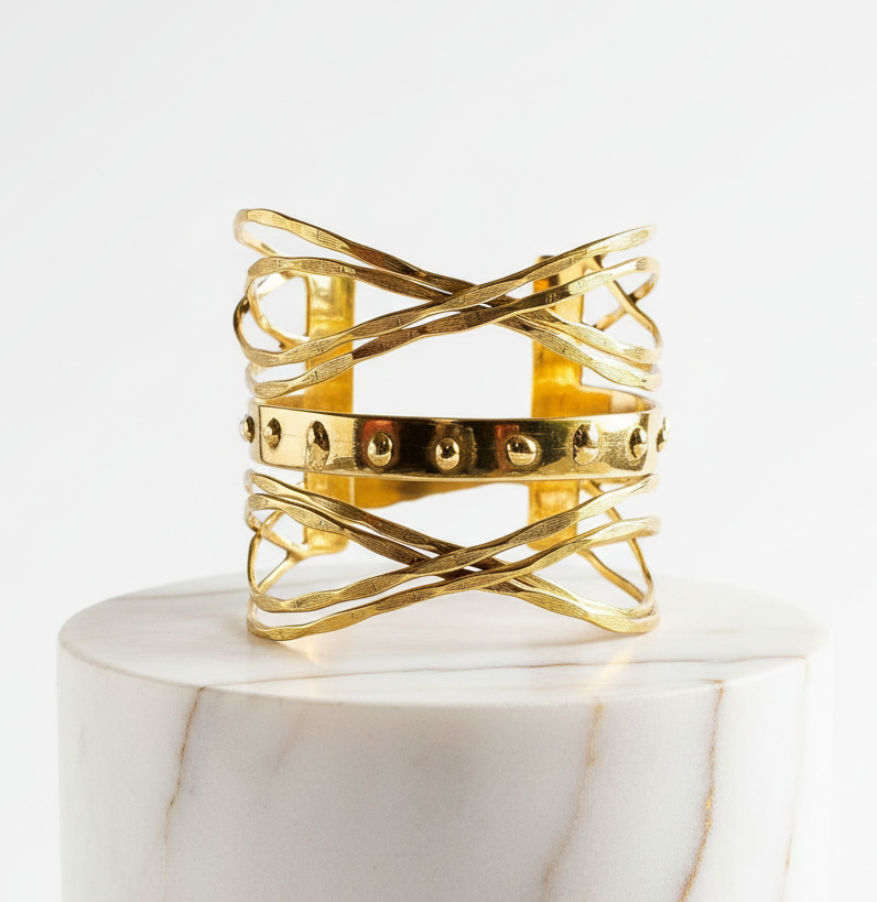 Gold multi-layered handcrafted brass cuff with intersecting sculptural bands and central studded detail. ZoharasVogue 