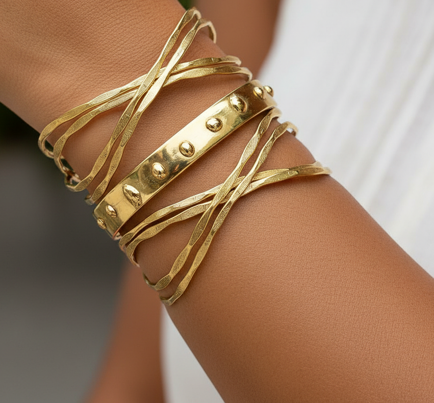 Gold multi-layered handcrafted brass cuff with intersecting sculptural bands and central studded detail. ZoharasVogue 