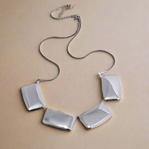 Parisian Charm Necklace featuring a sleek geometric square pendant on a gold-plated stainless steel collar chain. Waterproof, tarnish-resistant, and effortlessly chic—perfect for bold, modern style. Zoharas Vogue