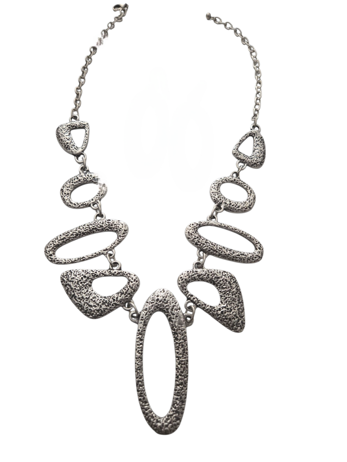 Silver necklace with geometric pendant on a white background