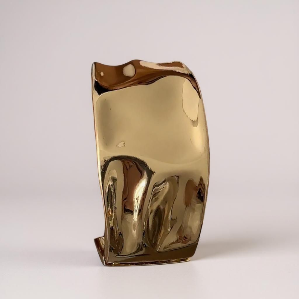 Zoharas Vogue Monarque Gleam Bangles — elegant gold bangle set with sculpted curves, styled on a velvet jewelry tray.