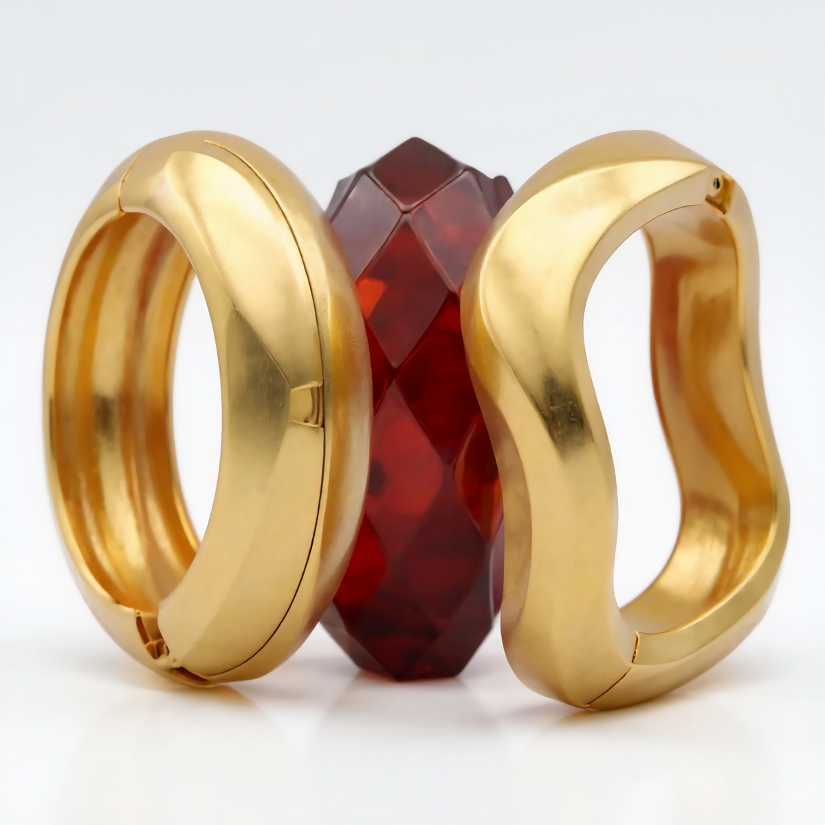 Set of geometric gold-tone mood bangles with acrylic accents in mixed colors, adjustable fit, trendy and modern design