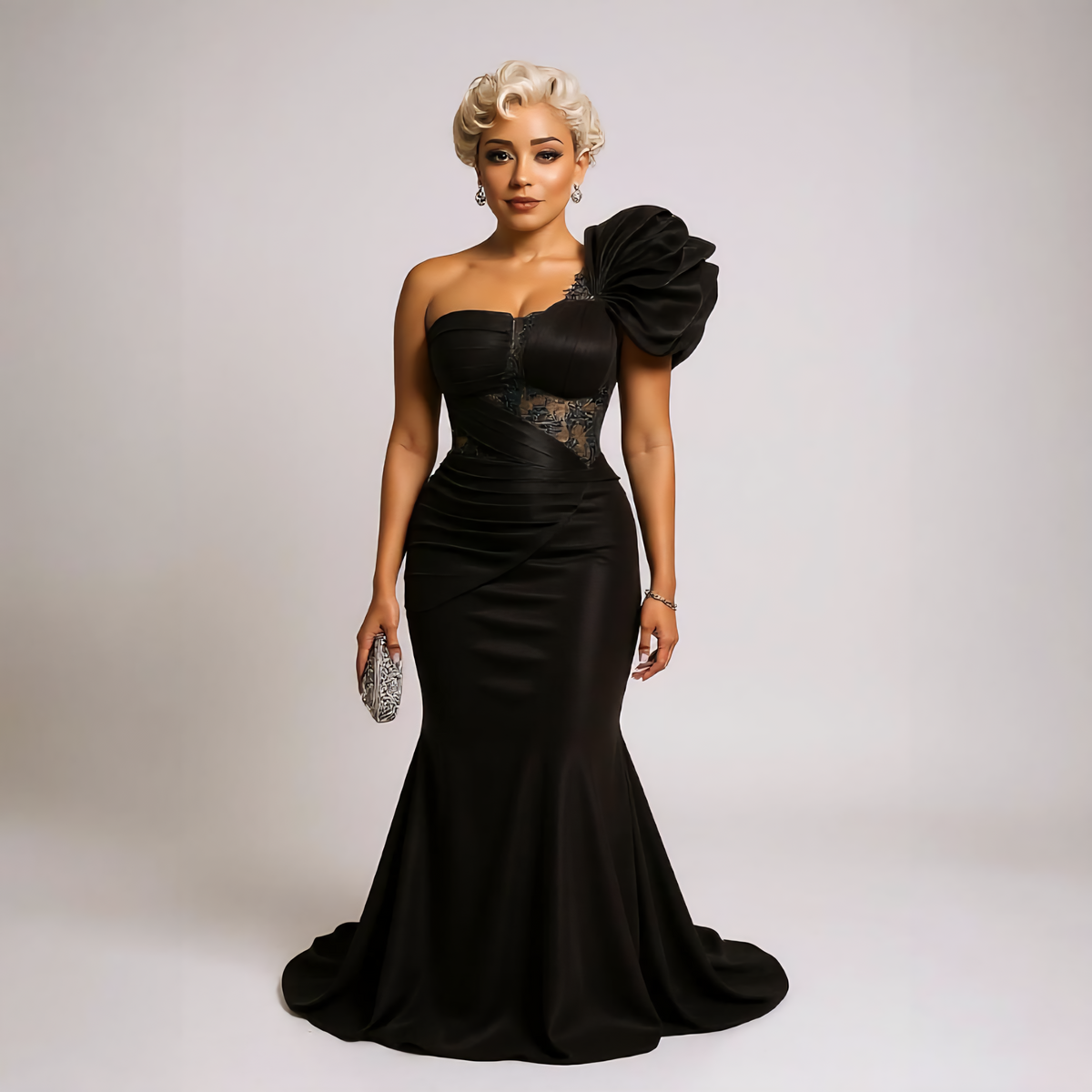 Crafted from luxurious satin with vintage-inspired pleated detailing and a sophisticated trumpet silhouette, this gown perfectly hugs your curves while allowing graceful movement. 